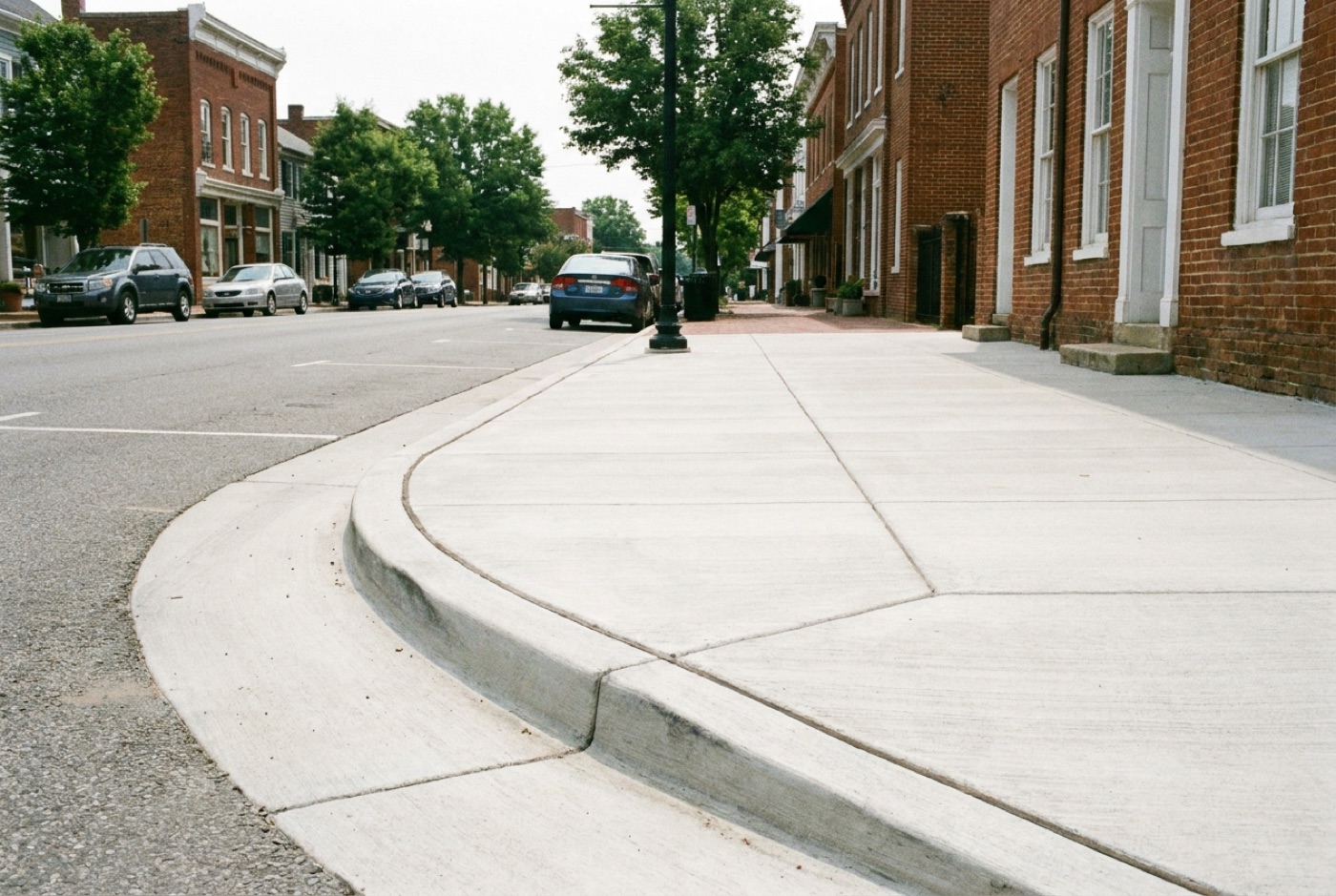 Fresh commercial concrete sidewalk with curb and gutter